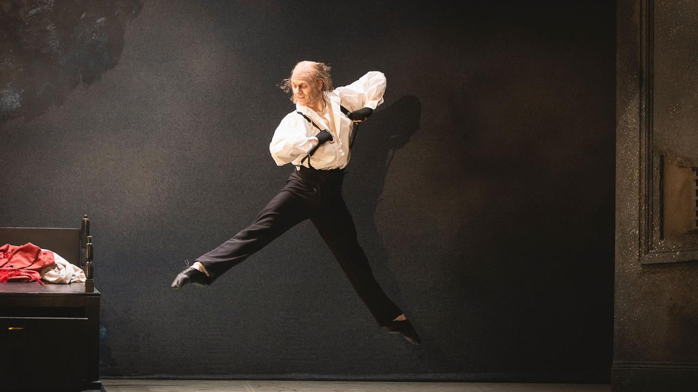 Scrooge in the morning after his spectral visitors leaps joyously while getting dresses