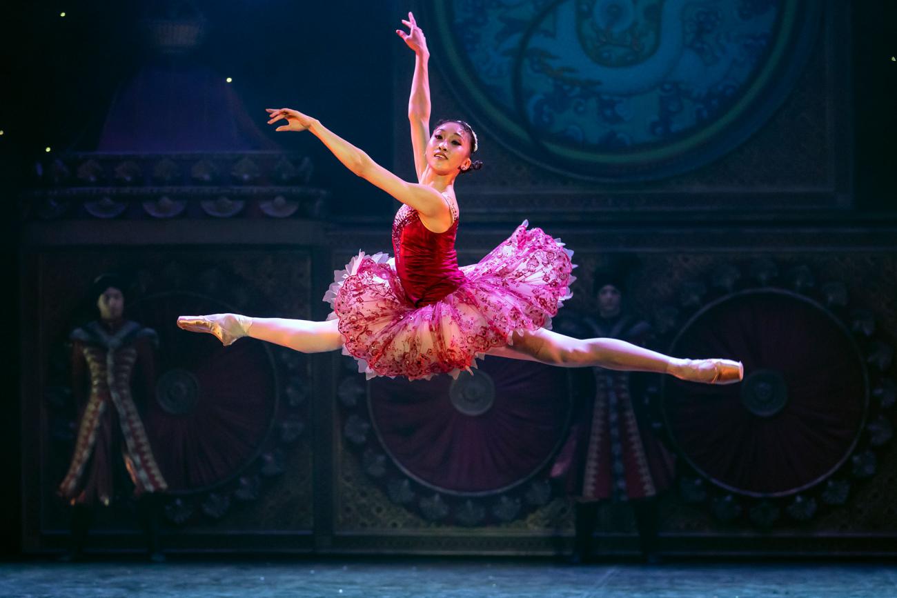 The Sugarplum Fairy leaps forward in an impressive grand Jeté