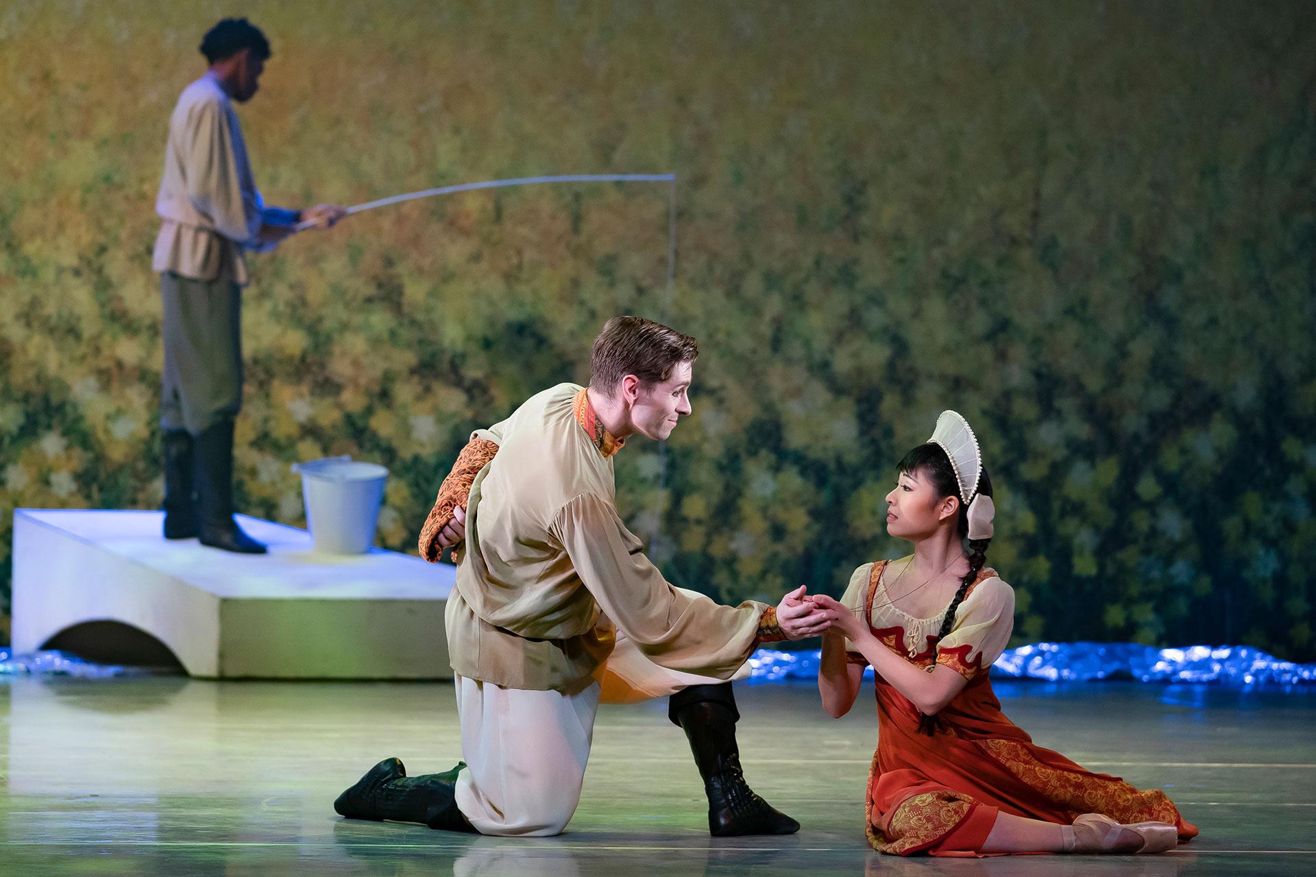 Ashley Dixon's Father holds the hand of Miki Akuta's Young Cinderella to lift her out of her sadness. Photo Emma Kauldhar.