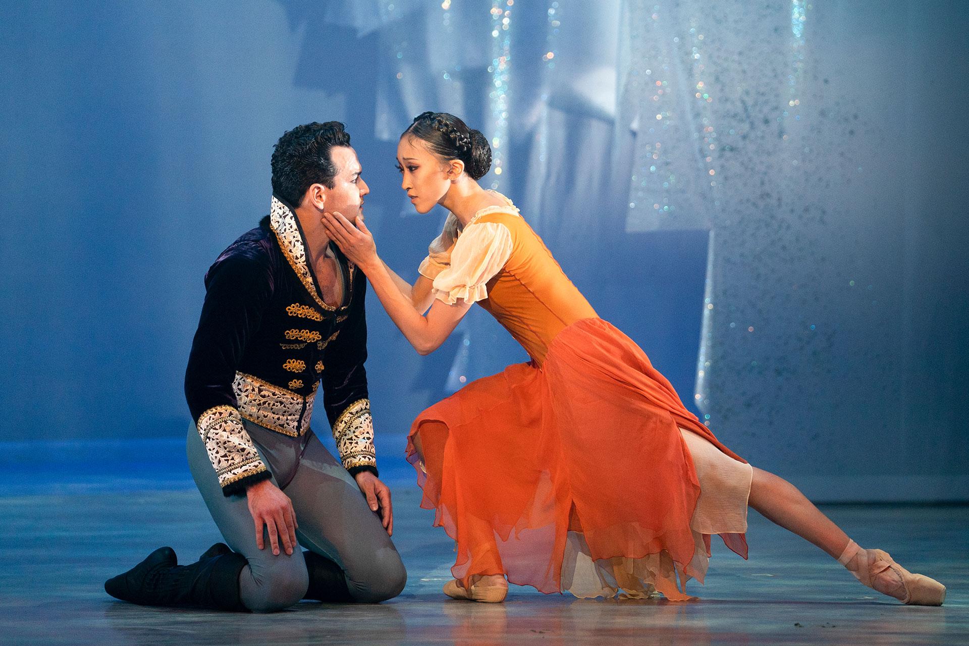 Minju Kang's Cinderella lovingly holds the face of Javier Torres's Prince as they come to terms with their feelings. Photo Emma Kauldhar.