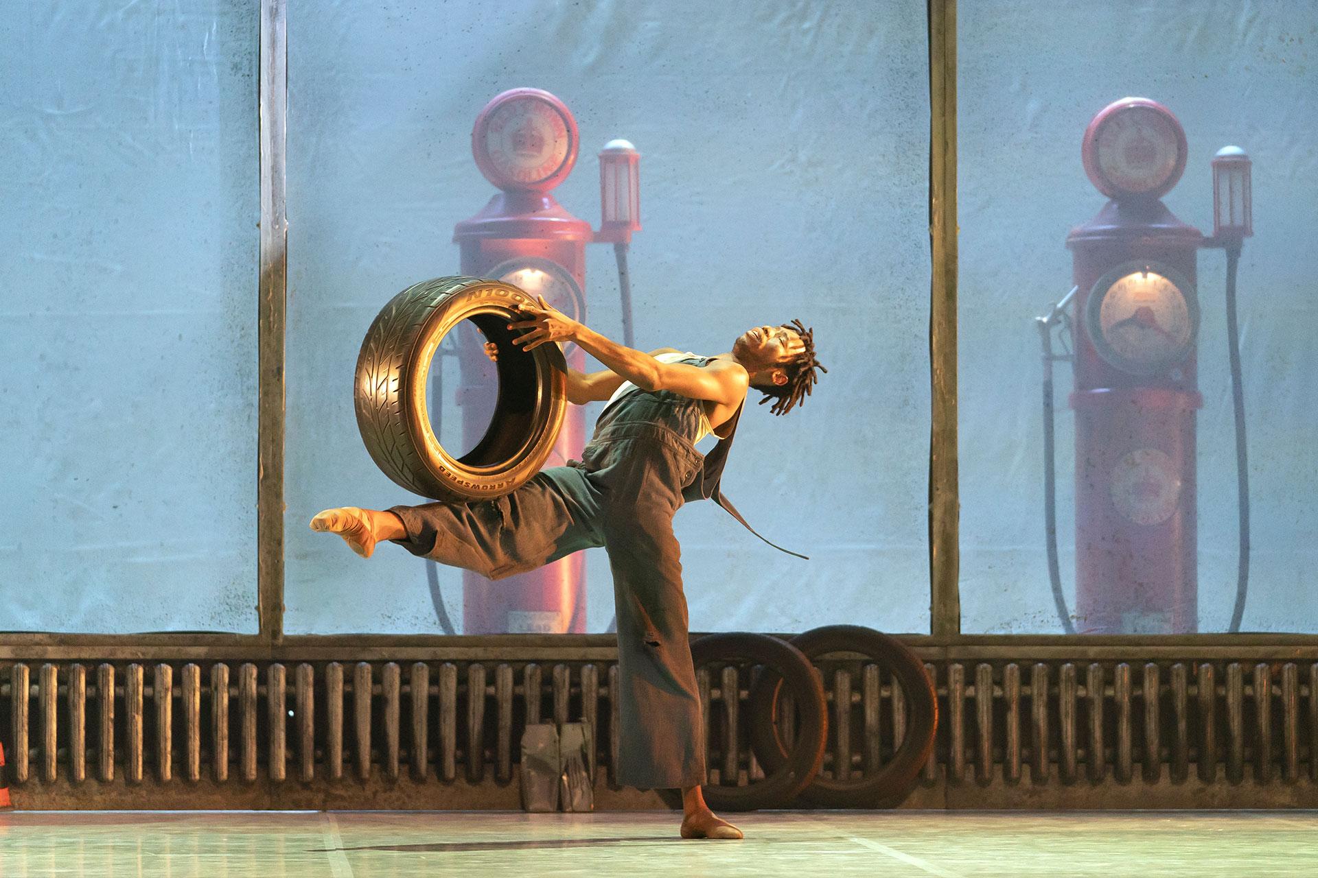 Geroge Wilson, performed by Mlindi Kulashe, dances a lament in his garage wondering where his wife, Myrtle is. Photo Emma Kaudlhar.