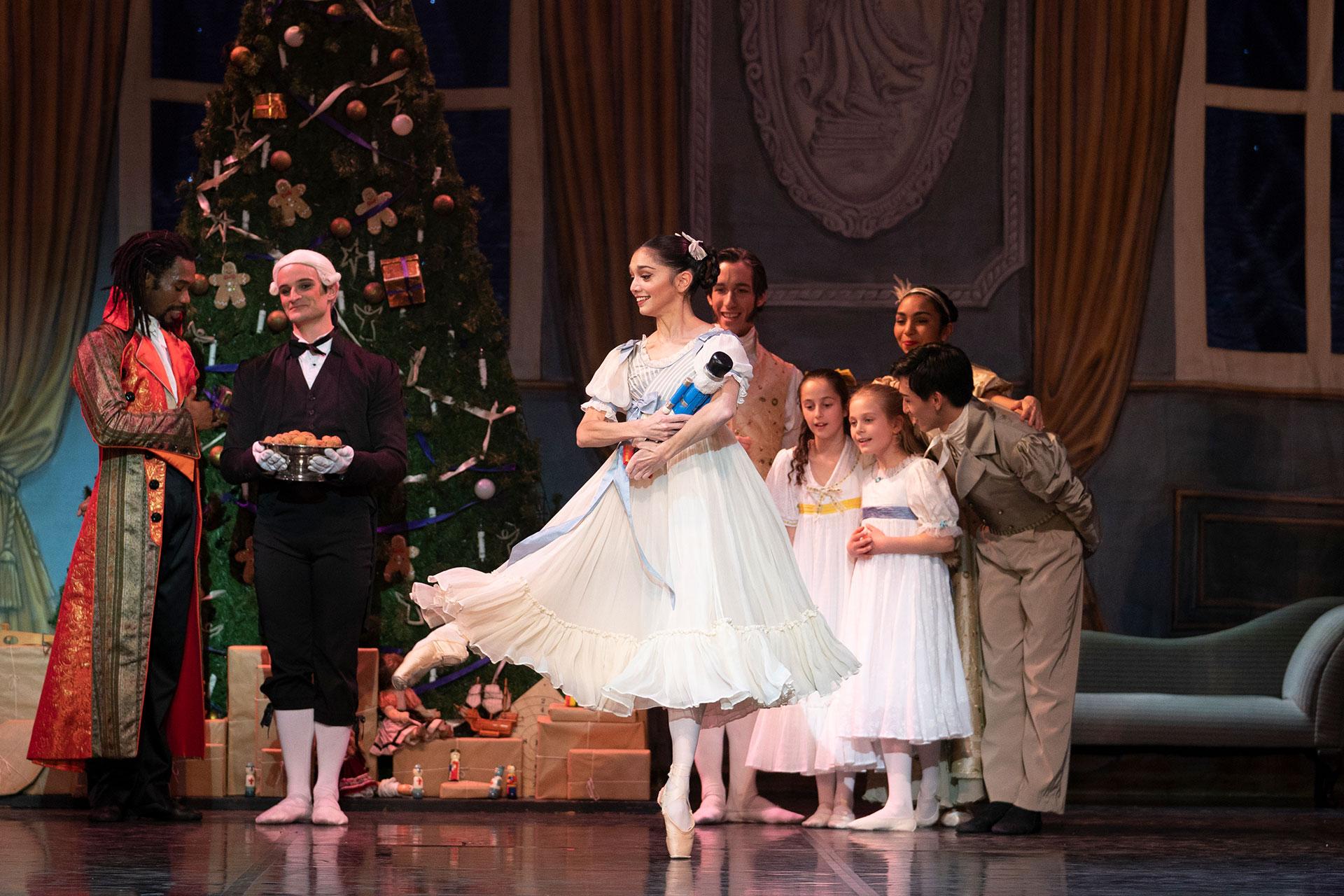 Clara holds her toy nutcracker doll she has received for Christmas