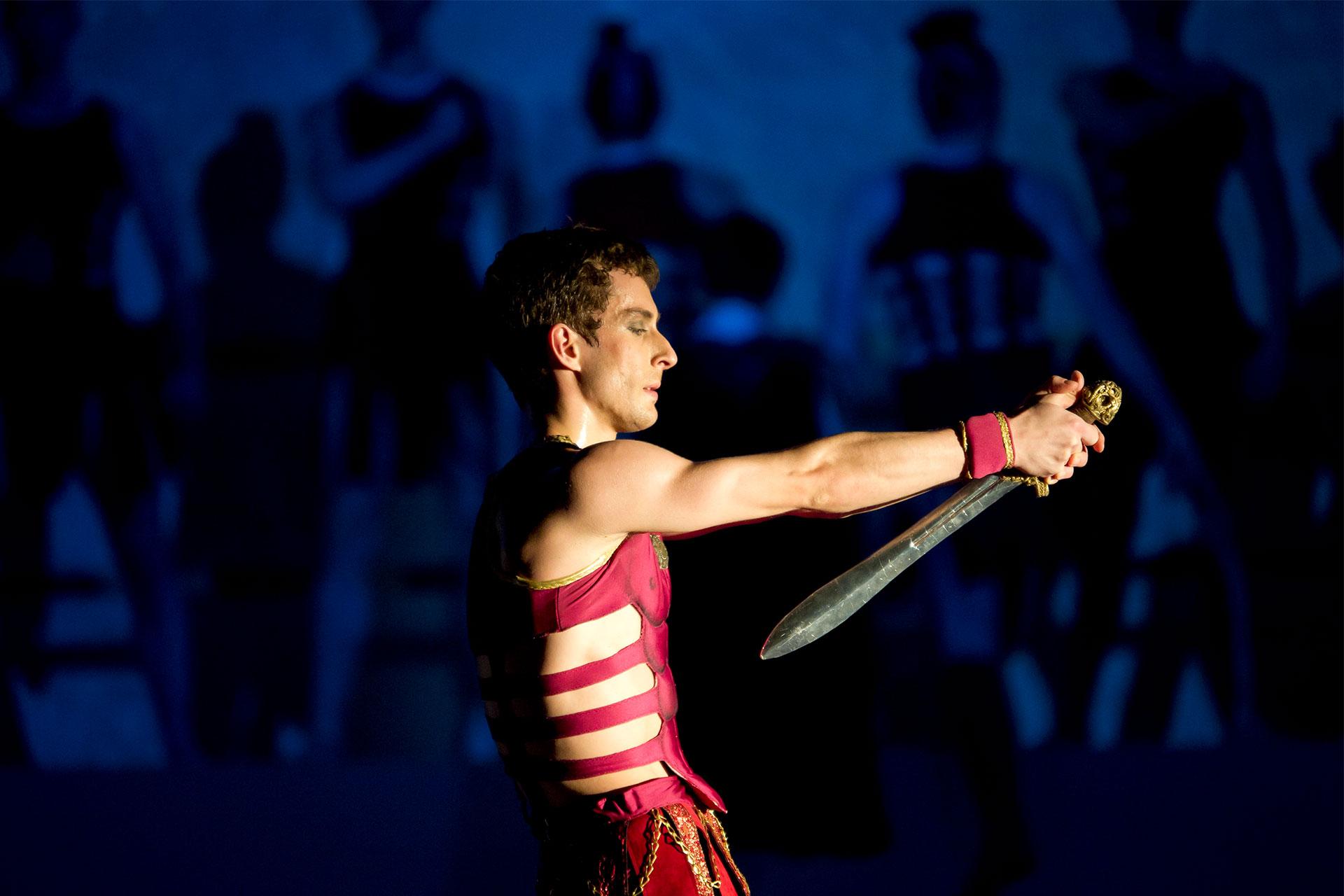 Mark Antony prepares to stab himself with his sword