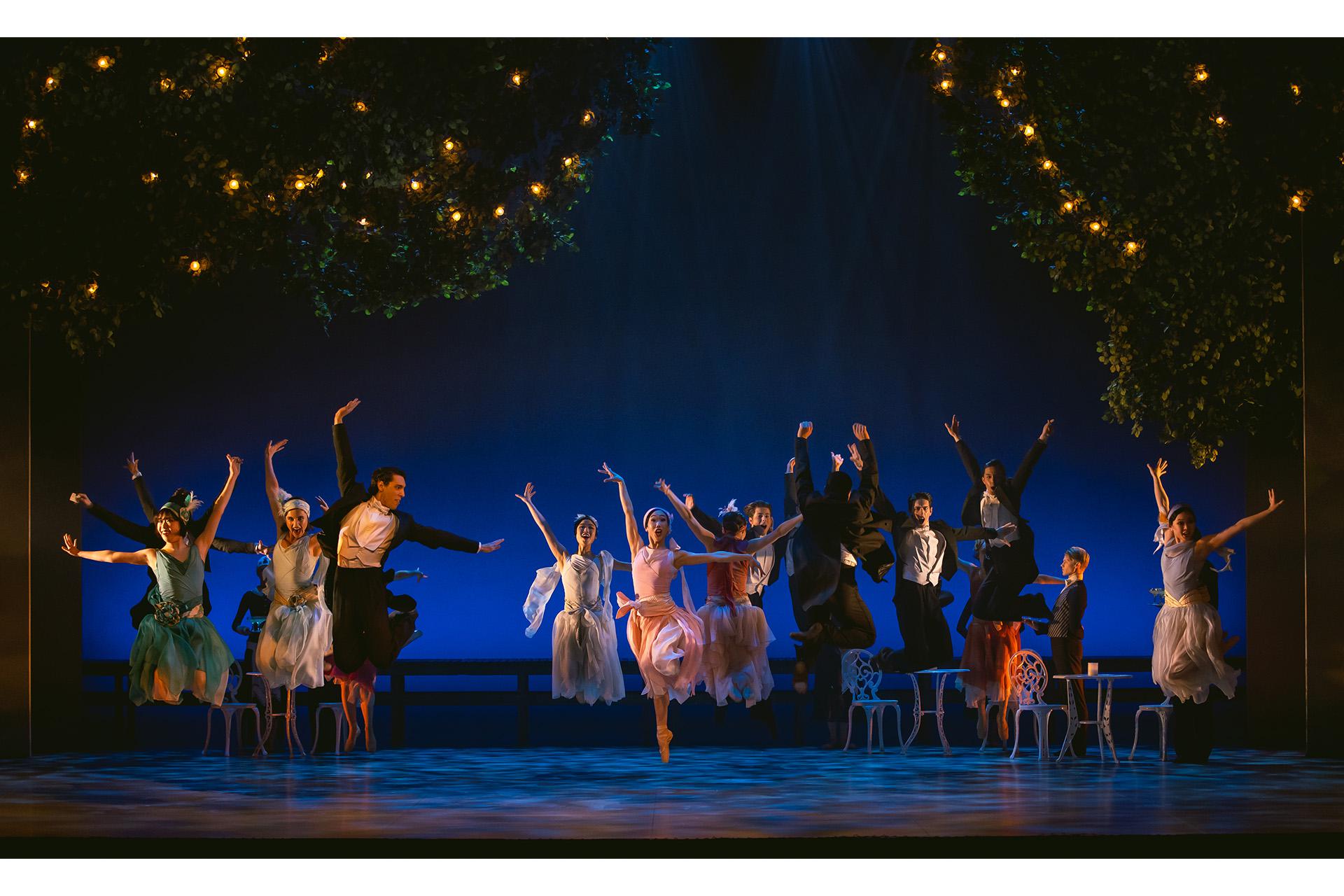 Dancers leaping in unison