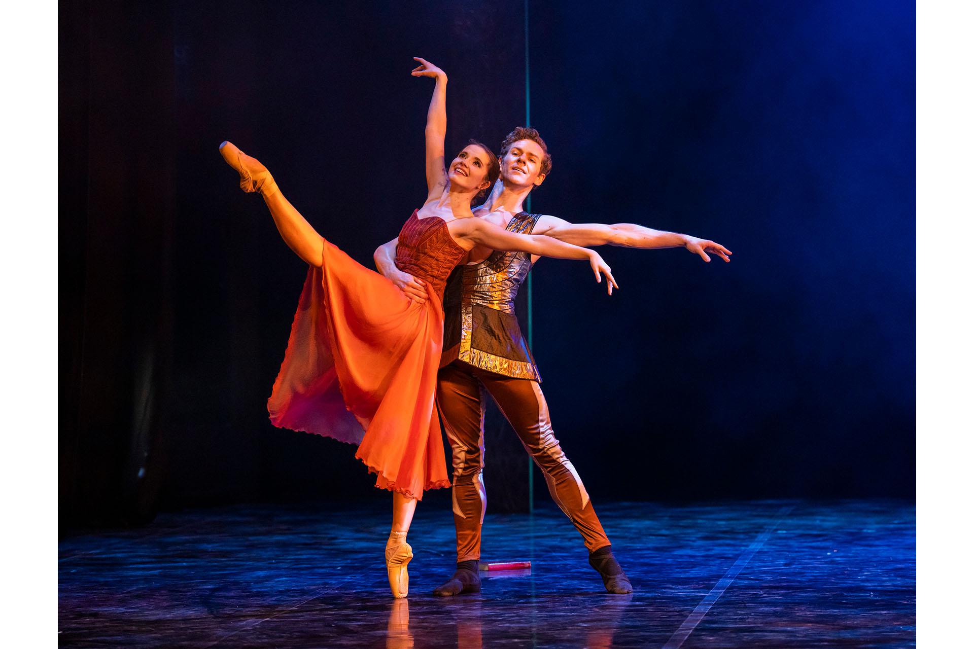 Beauty and Prince Orian dance lovingly, Beauty en pointe on one foot, her other leg raised in front of her