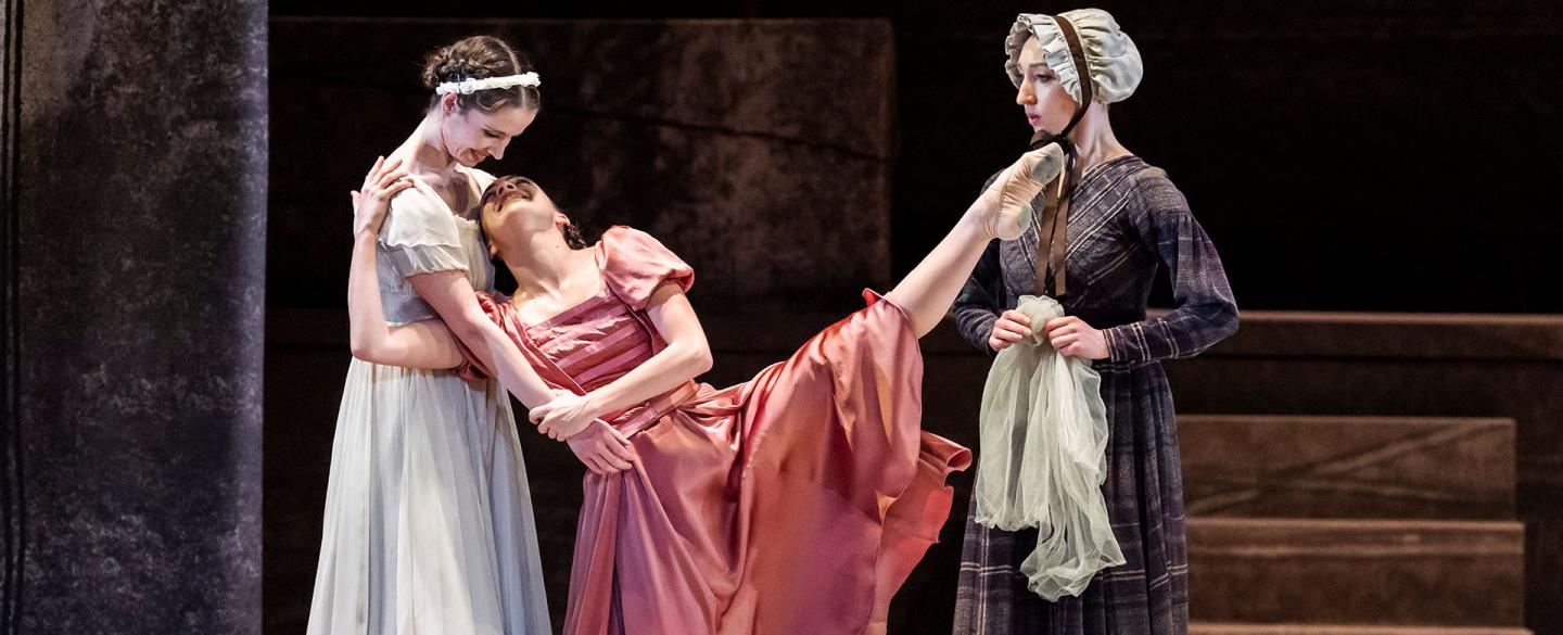 Jane in white hugs with Adele in pink, but very happy as a stern Mrs Fairfax looks on