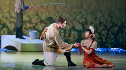 Ashley Dixon's Father holds the hand of Miki Akuta's Young Cinderella to lift her out of her sadness. Photo Emma Kauldhar.