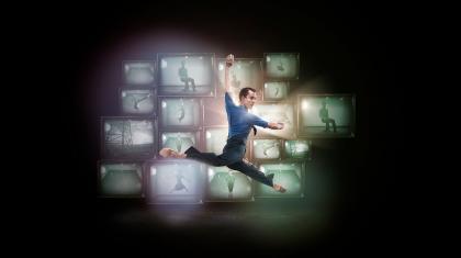 Poster photo for 1984 with Tobias Batley leaping in front of countless vintage televisions.