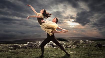 Heathcliff lifts Cathy on the moors on our poster for Wuthering Heights.