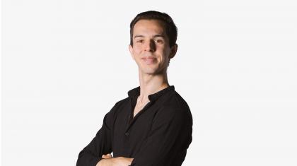 Headshot of a male dancer in a black shirt